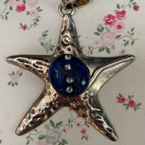 Silver Starfish Pendant with Blue glass middle.